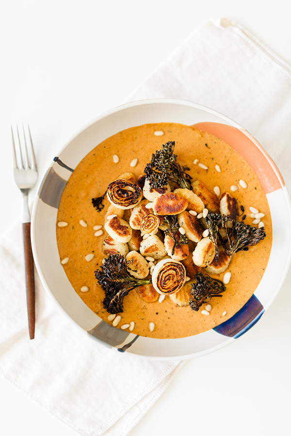 POTATO GNOCCHI WITH RED PESTO ONION BRÛLÉED AIR FRIED BROCCOLINI, AND PINE NUTS, cooking at home, nutrition, food blogger, Sun and Salt Wellness